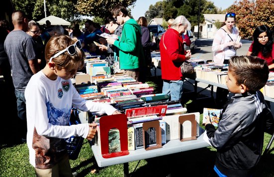 Local library fans take in Kings County Book Sale and get sneak preview of expansion Local book enthusiasts, including these two youths, look for good reads at Saturday's (Oct. 12) Bi-annual Kings County Book Sale held at the Lemoore Library.